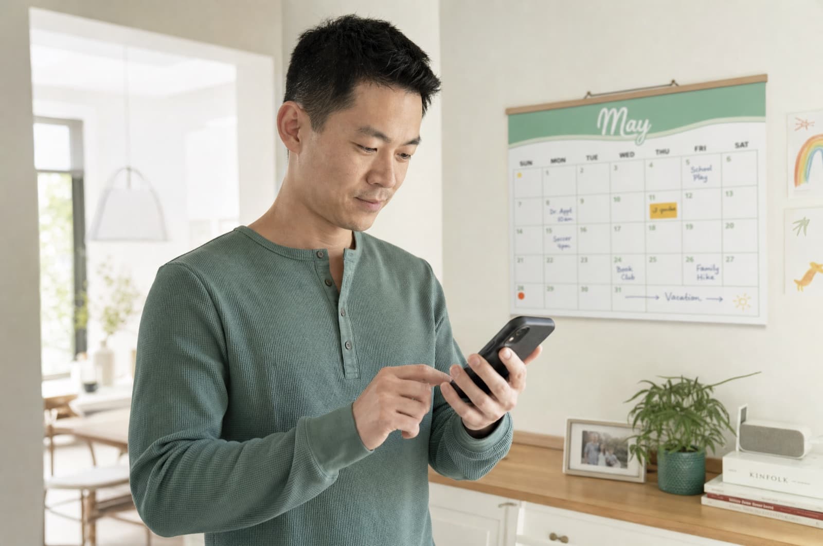 A parent checking the shared family calendar